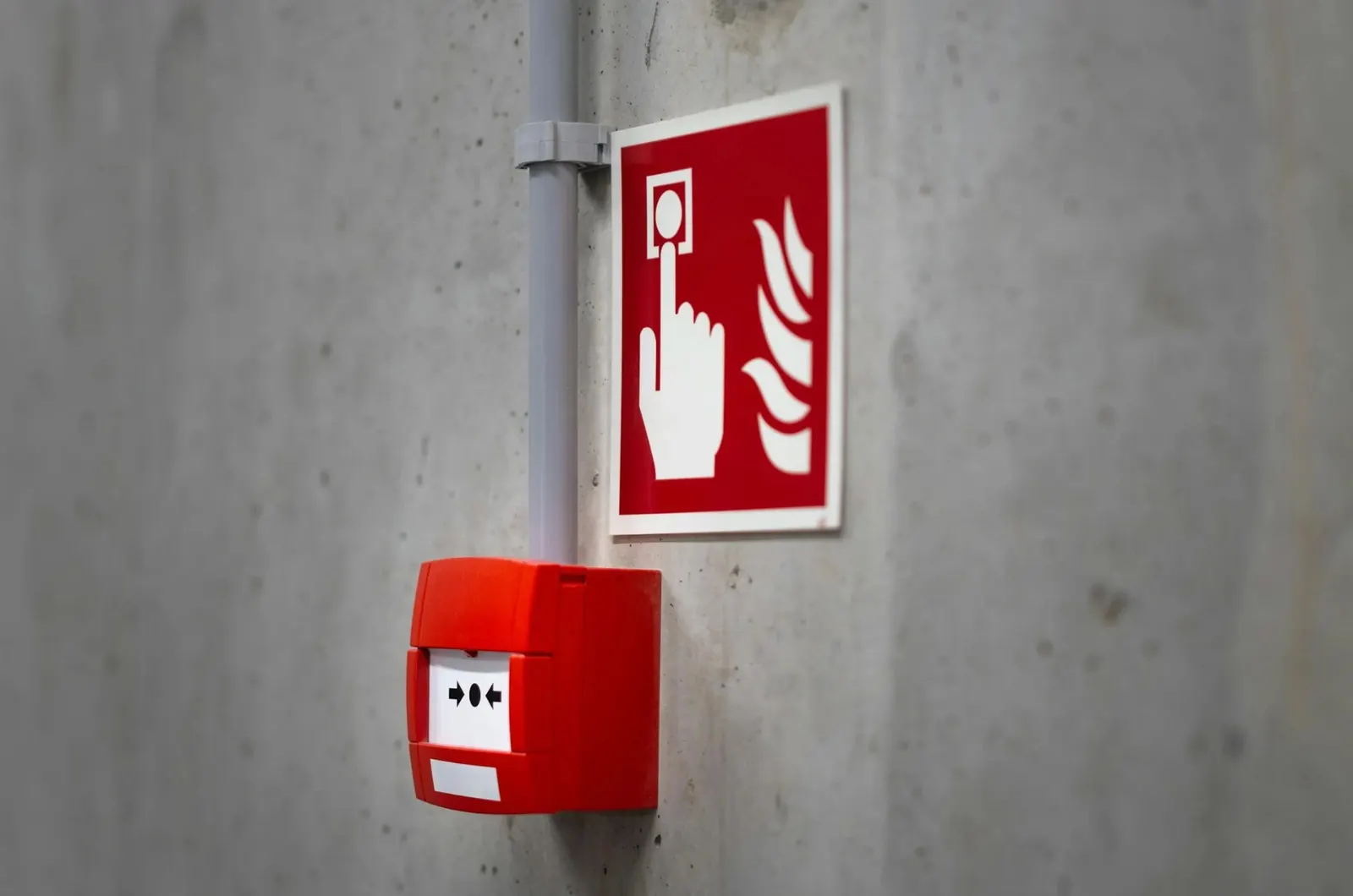 A fire alarm call point on a wall
